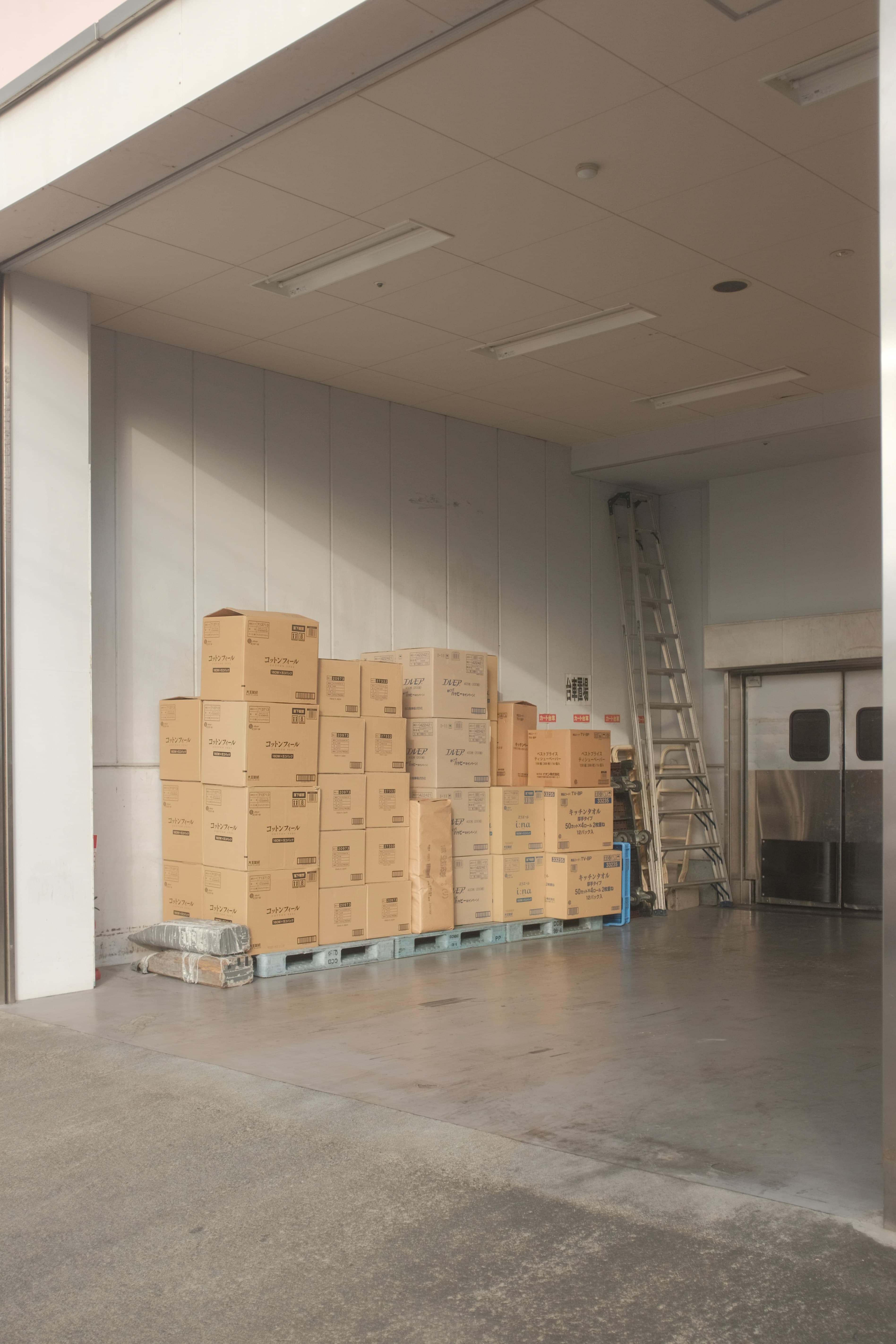 Stacked cartons staged at a loading dock